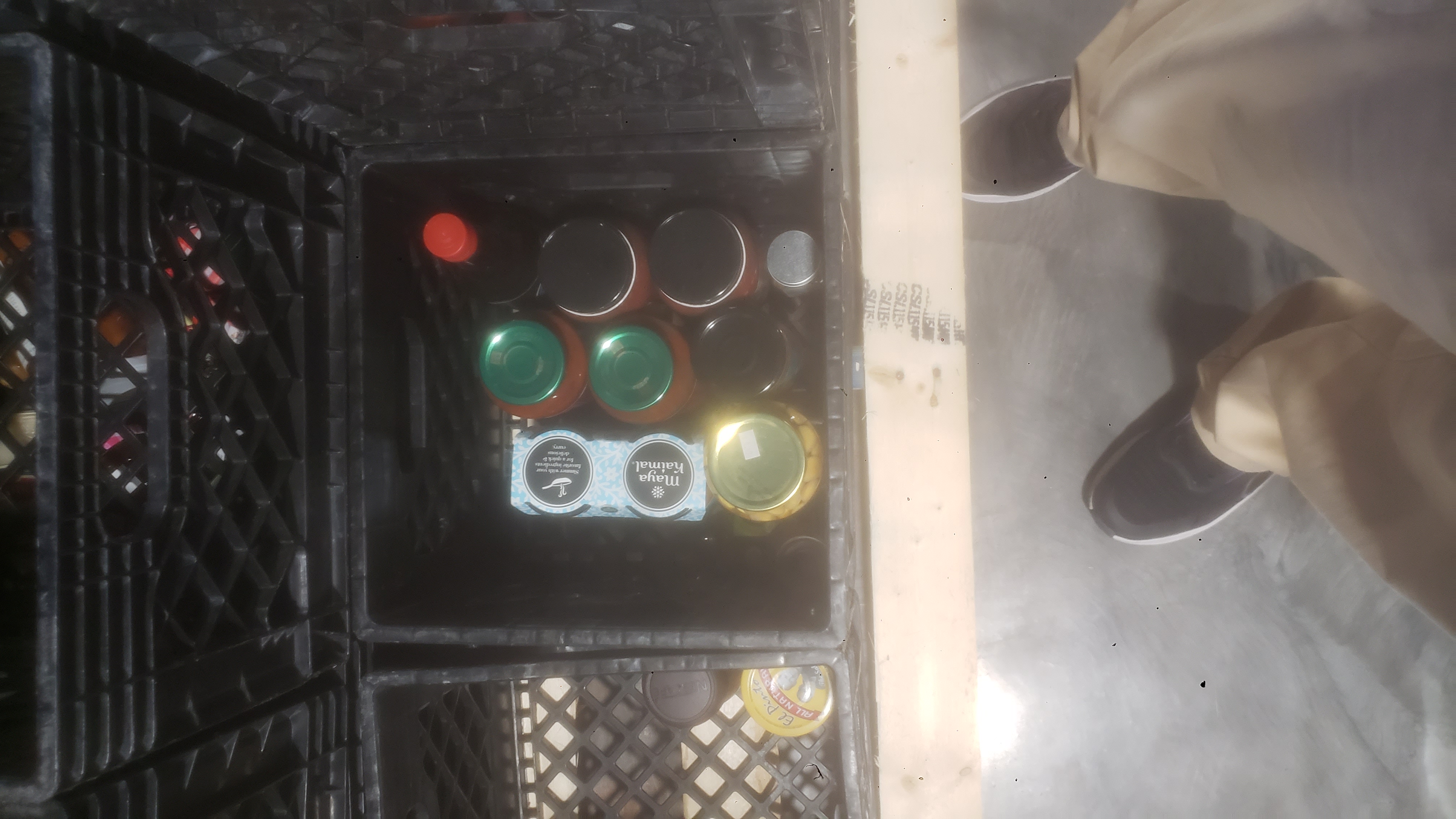 Glass jars in a crate.